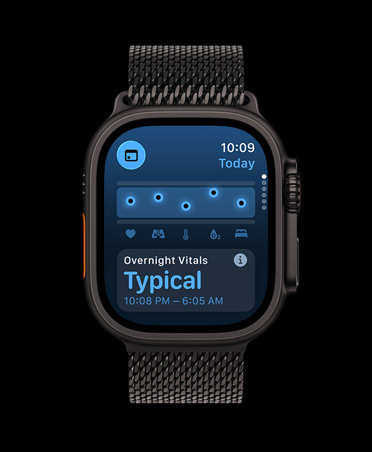 Apple Watch Ultra 3 com caixa em titânio preto, app Sinais Vitais com gráfico de pontuação de saúde e notificação de valores de sinais vitais durante a noite fora do normal, bracelete Loop milanesa preta